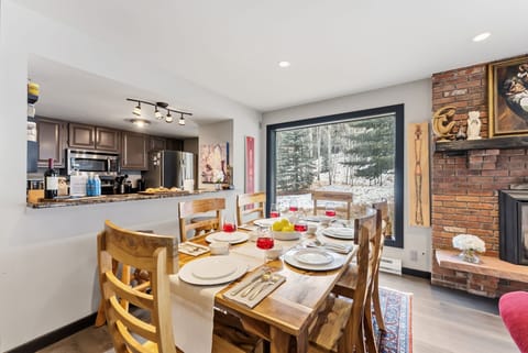 Dining area: Dining table with 7 seats, 2 barstools