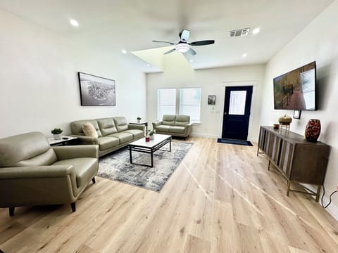 Livingroom / leather sofa/ coffee table and 2 end tables / 55” TV / console