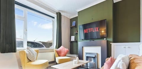 Relax in the stylish living area featuring cozy seating and a welcoming atmosphere.