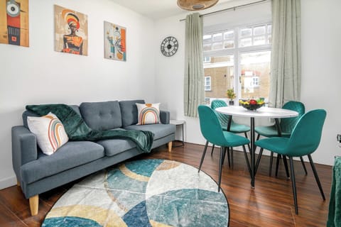 Bright open-plan living, dining and kitchen area with modern decor
