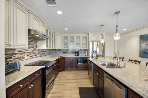 Kitchen, fully stocked with cooking/eating/drinking utensils