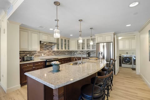 Kitchen, fully stocked with cooking/eating/drinking utensils