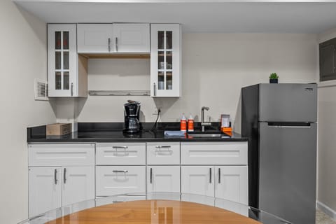 A compact kitchenette is available for simple meal prep during your stay, complete with the essentials you’ll need for a convenient home-away-from-home experience.