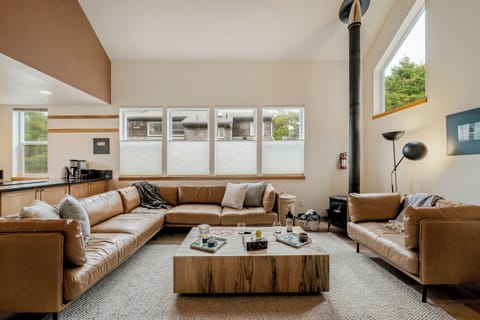Wood stove and comfy couch for gathering.