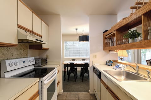Your fully equipped kitchen awaits with everything you need, next to the charming dining nook where you can savor breakfast with natural light streaming in.