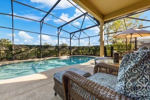 PRIVATE POOL and HOT TUB surrounded by lounge chairs.
