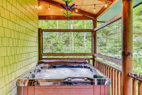 Hot Tub Haven, soak in luxury while surrounded by nature's beauty and twinkling lights!