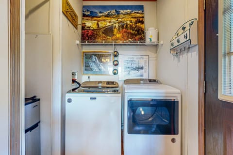 Enjoy the convenience of onsite laundry with mountain-inspired decor!