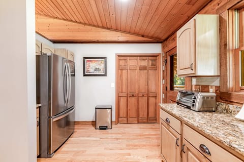 Granite counters gleam in this bright space, perfect for culinary adventures!