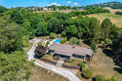 Explore the lush grounds and unwind by the sparkling pool in nature's embrace!