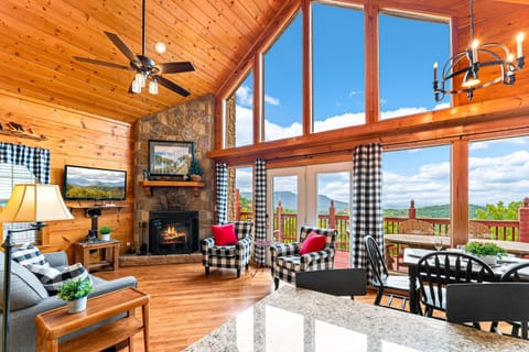 Private covered deck hot tub surrounded by lush forest views. Relax year-round while soaking in peaceful Smoky Mountain scenery.