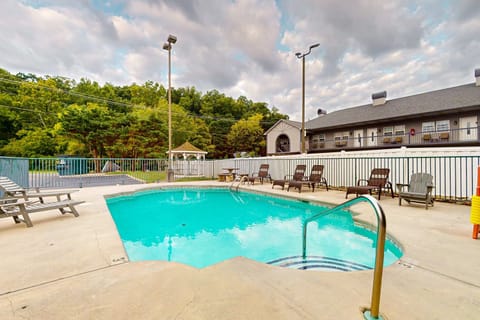 Seasonal shared outdoor pool with lounge chairs & mountain/wooded views. And, relax at this hideaway with pool access, sun deck, and plenty of seating; perfect summer getaway near hiking, attractions, and family-friendly fun.