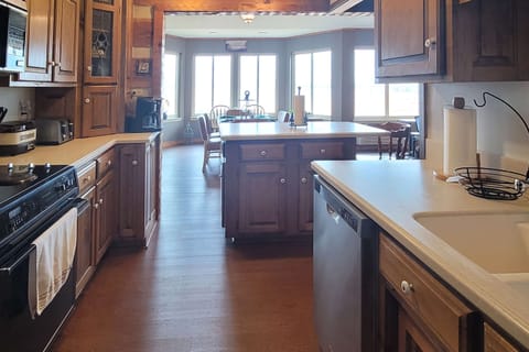 Experience culinary delights in a spacious kitchen with stunning lake views!