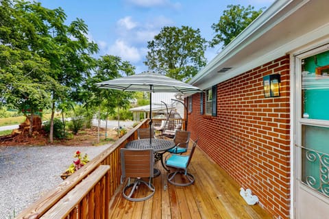 Enjoy meals al fresco under the umbrella, surrounded by natureโs beauty!