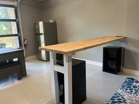 Fun bonus room with bar-height table, mini fridge, and extra hangout space. Great for game nights, group trips, family vacations, and relaxing cabin entertainment.