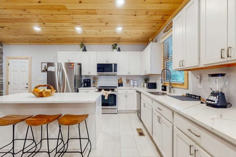 cook your favorite meals in this large well stocked kitchen