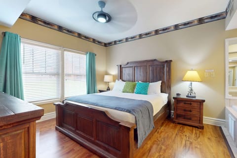 Inviting space with a stone fireplace, stylish decor, and cozy seating. Perfect for relaxation!