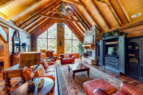 Expansive timber ceilings and plush seating invite you to unwind in style, in our living room. 