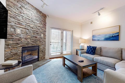Relax by the stone fireplace and enjoy the mountain views from your retreat!