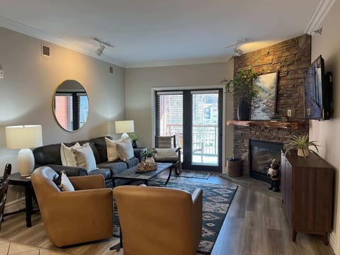 Gather around the stone fireplace for movie nights and mountain views!