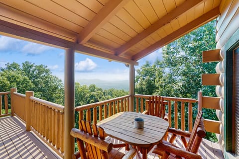 Your balcony retreat awaits. And, enjoy mountain views from this charming outdoor dining space!