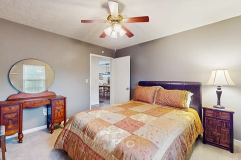 Charming bedroom awaits. And, relax in style with a plush bed and vintage dresser in a serene getaway!