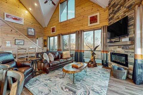 Living room oasis awaits. A bright, airy space with stunning views, comfy seating, and rustic charm awaits!