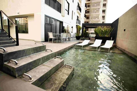 Arrive to shimmering waters and resort-style lounging steps.