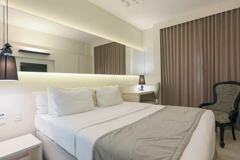 Stretch out in a serene, modern room with warm lighting.