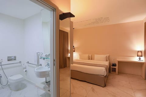Refresh easily in a bright, accessible bathroom beside your room.