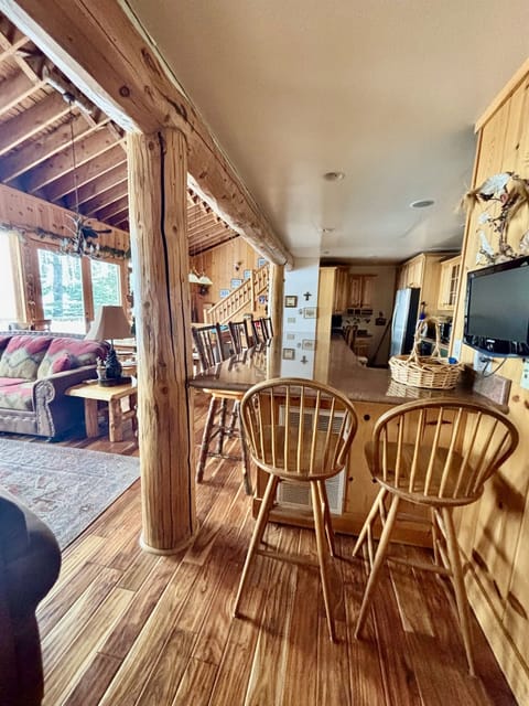 Our open concept kitchen has plenty of extra seating along the wrap around island. Its my favorite place to cook because you can look out at Lake Tahoe the entire time you are in the kitchen while sharing the spac ewith other. There is also a desk area.