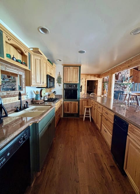 Our full kitchen has everything that you should need to cook meals in for the entire group. We have an oven, gas stove, diswasher, microwave, garbage compactor, coffee maker, keurig, toaster oven and many other appliances and cooking utensils.