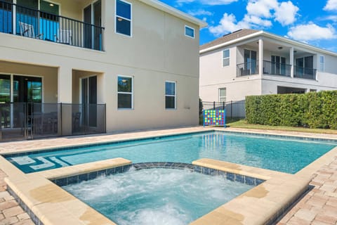 Resort-style pool area with loungers