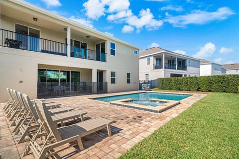 Resort-style pool area with loungers