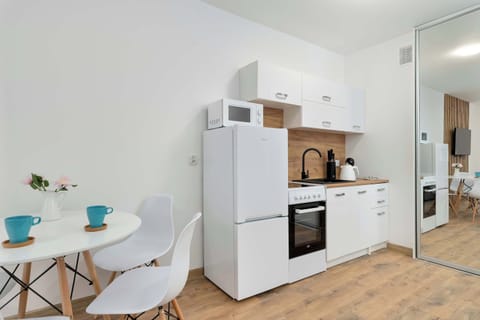 The kitchenette's practical layout maximizes space and functionality.
