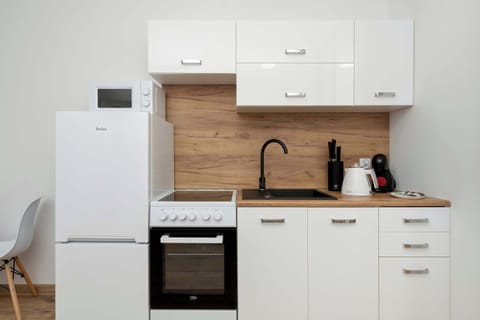 The fully equipped kitchenette includes everything you need for a home-cooked meal.