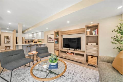 Comfortable living room with 4K Smart TV in an Ottawa rental.