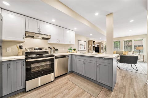 Bright open-concept living and kitchen layout in an Ottawa home.