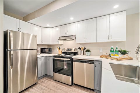 Fully stocked kitchen with modern appliances in an Ottawa suite.