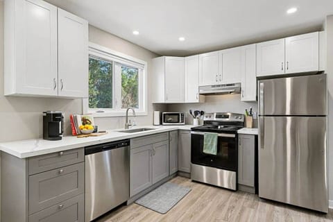 Sun-drenched kitchen with a large picture window in our Ottawa home.