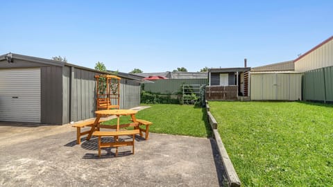 Sunny backyard with seating perfect for outdoor dining