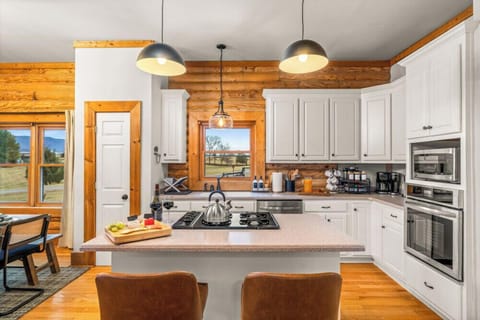 Cook comfortably with ample counter space, plenty of cabinets, and essential kitchen items—ideal for prepping meals, serving drinks, or hosting a group dinner.