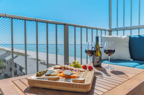 Savor every sunset with wine, bites, and breathtaking Gulf views from your private balcony escape