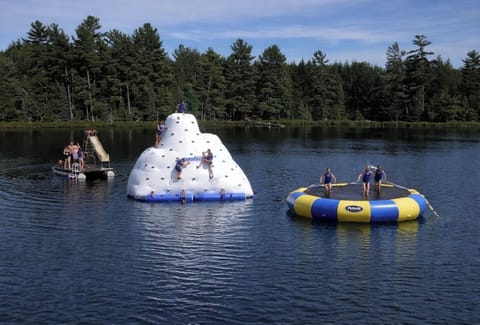kids favorite inflatables: iceberg and water bouncer, water sled on the raft