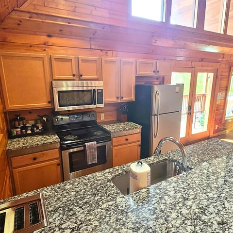 Granite counters open to it all with an expansive bar