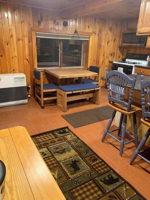 Kitchen area with stove, refrigerator, microwave, coffee maker & air fryer