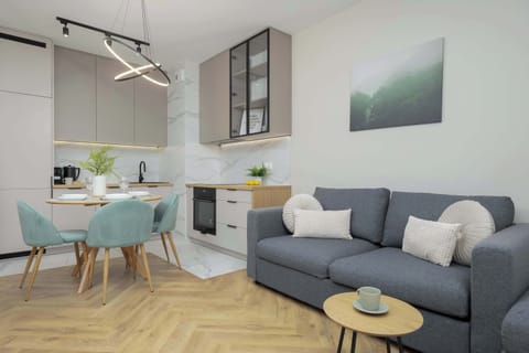 Relax in the stylish living room with a comfortable sofa and modern decor.