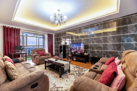Living Room with Recliner couches, 55" Smart Tv, Wifi (30+ Mbps) & Work desk.