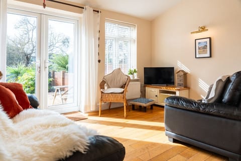 Light-filled lounge area, patio doors to beautiful garden