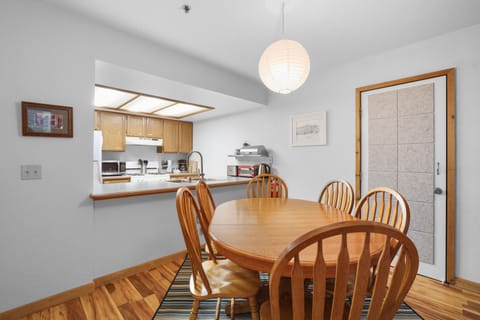Embrace mountain living with an open kitchen that flows into a sunny dining space. Perfectly designed for culinary adventures, it’s where you’ll whip up meals while enjoying alpine views.